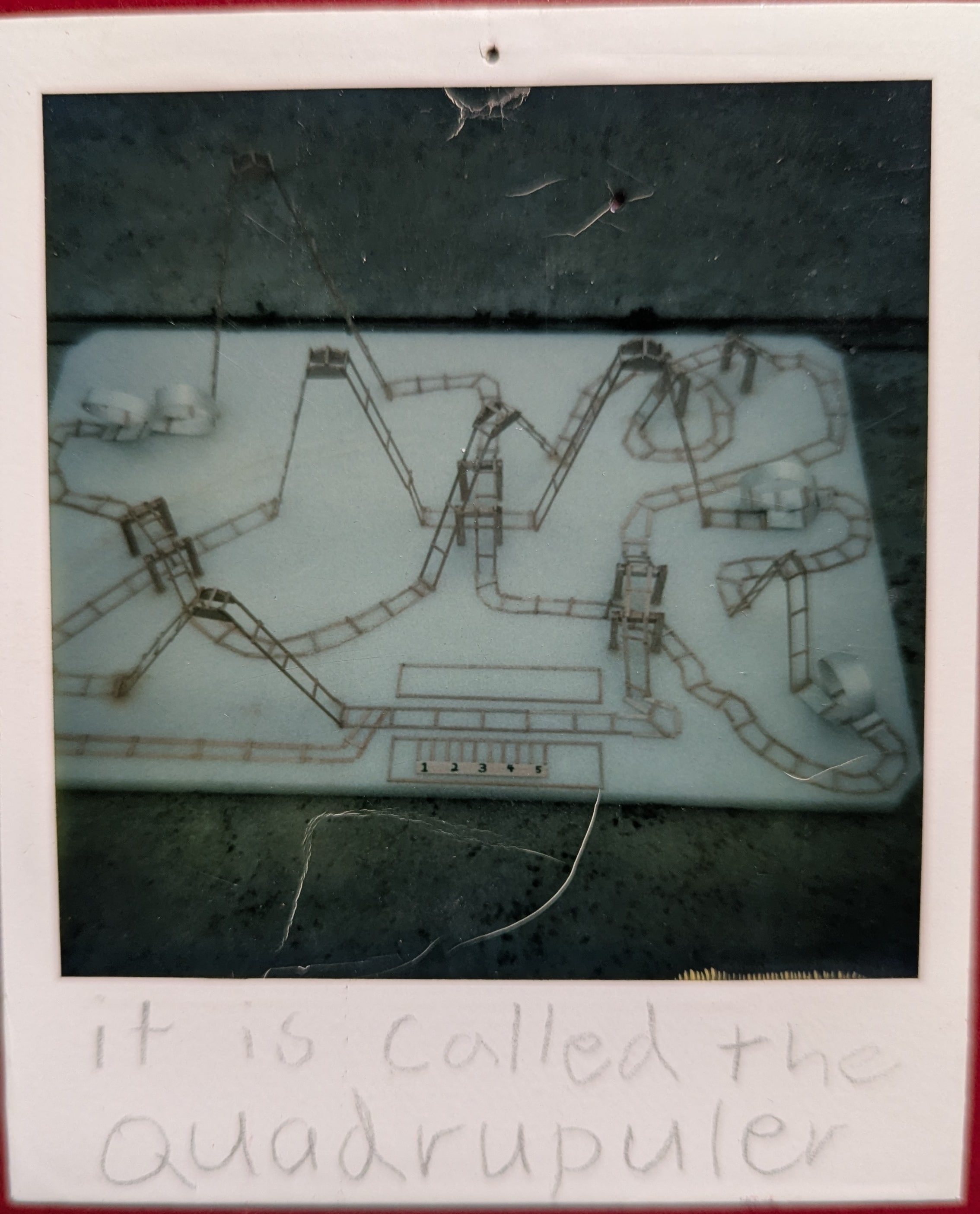 Polaroid photo of the balsa wood roller coaster model